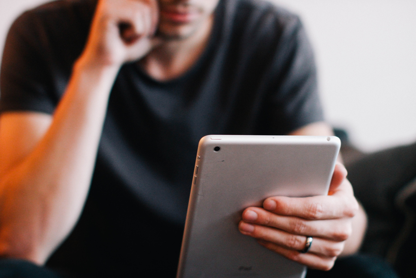 man reviewing tablet